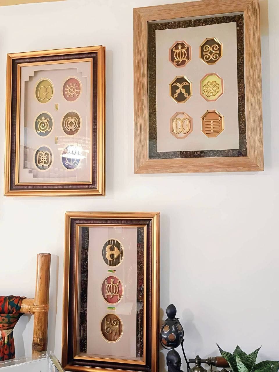 Ornate African shadow box with decorative medallions crafted in Ghana